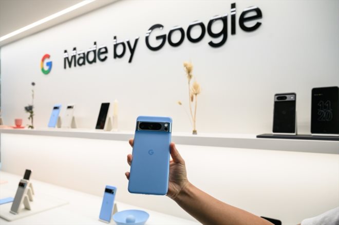 A Google Pixel 8 pro phone is displayed during a product launch event in New York