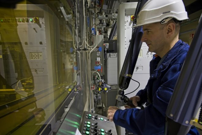 A technician operates mechanical arms in a high-activity cell at the Chinon nuclear power plant on January 26, 2023 in Indre-et-Loire