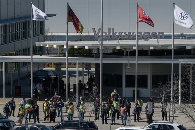 Employees in front of the entrance to the Volkswagen factory on March 20, 2024 in Chattanooga, Tennessee