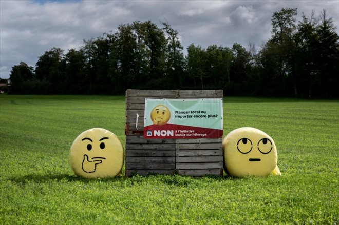 A poster against intensive farming in a field near Bioley-Orjulaz, Switzerland, September 17, 2022