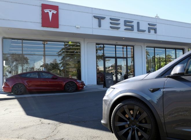 New Teslas are parked in front of a Tesla dealership in Corte Madera, California, October 18, 2023