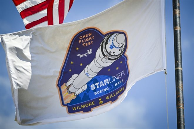 A flag with the logo of the first manned mission of Boeing's Starliner spacecraft, at Cape Canaveral, Florida on May 3