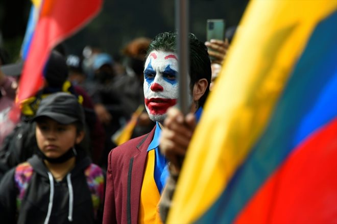 A man dressed as the Joker, an American comic book character, demonstrates near the Ecuadorian National Assembly on June 25, 2022 in Quito.